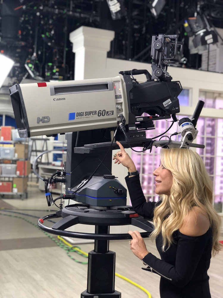 Lori directing a television show from behind the camera