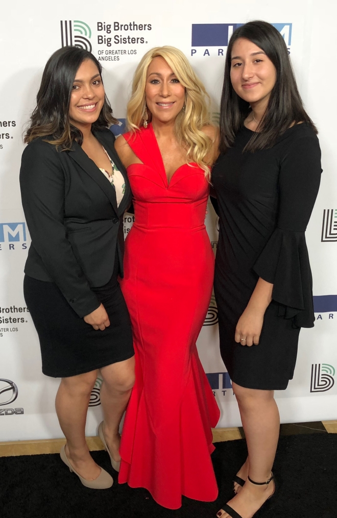 lori at a Big Brothers Big Sisters event with two women she mentored