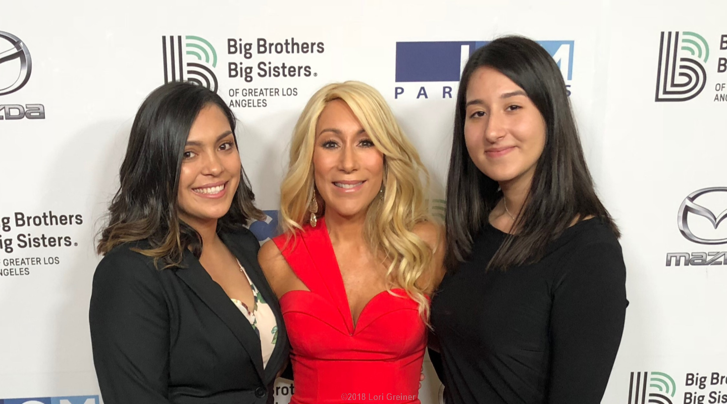 Lori at a Big Brothers Big Sisters event with two women she mentored
