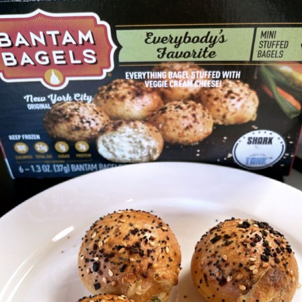 2 Bantam Bagels on plate with packaging behind.