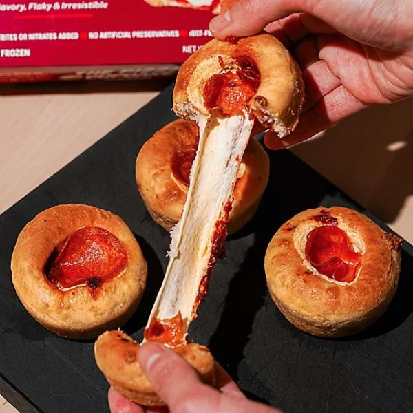 4 Pizza Cup Cakes, one being pulled apart cheesy