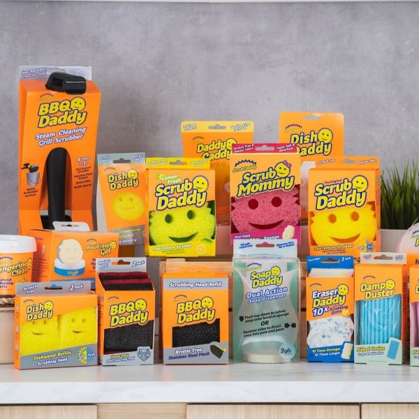 Selection of Scrub Daddy Products on table.