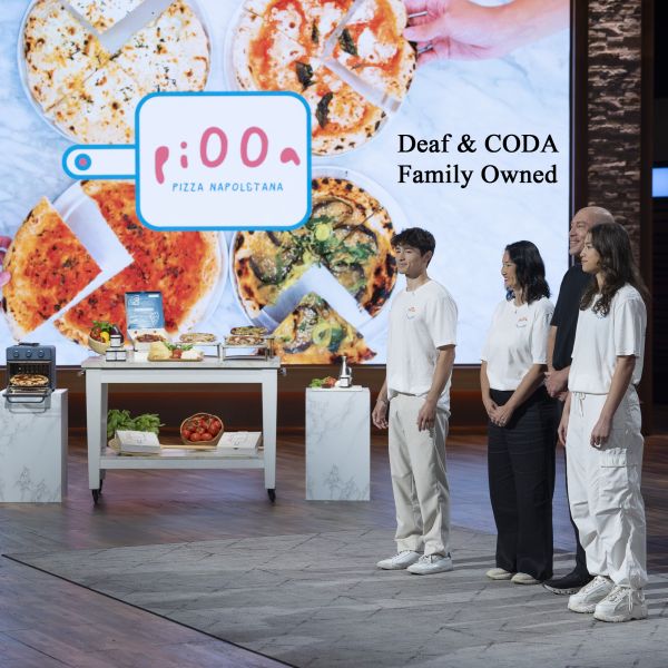 Piooa Pizza founders in front of table on Shark Tank set
