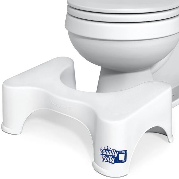 Squatty Potty product in front of toilet.